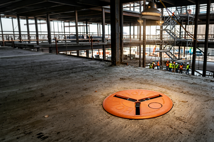 12 to 24 inch adjustable XL round hole cover high visibility orange construction site